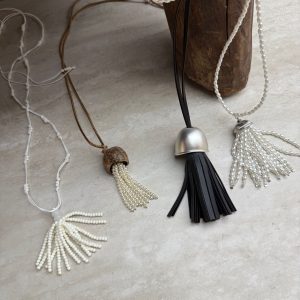 Korean ins bloggers same style Pearl tassel necklace female niche new long filigree cover fruit shell necklace sweater chain